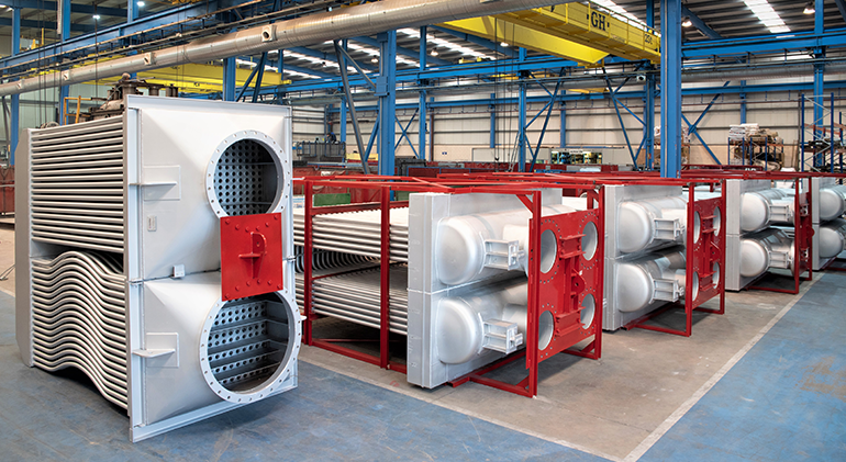 Industrial heat recuperator transfers energy from combustion gases to process air.